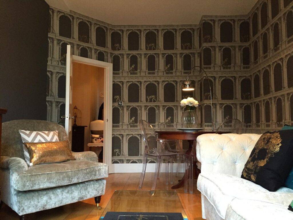 Opulent interior with Roman-style wallpaper featuring monkeys, decorated by SM Decorators in Essex